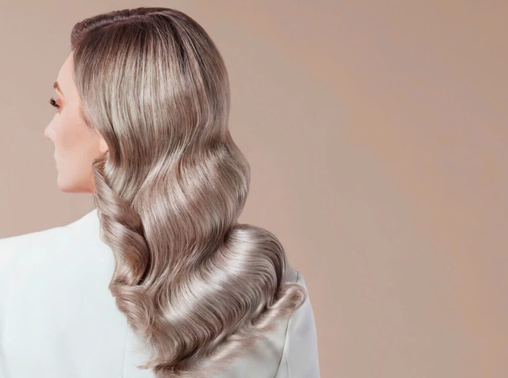Balayage summer hairstyle with soft blonde highlights at IRIS Hair Salon in Ho Chi Minh City